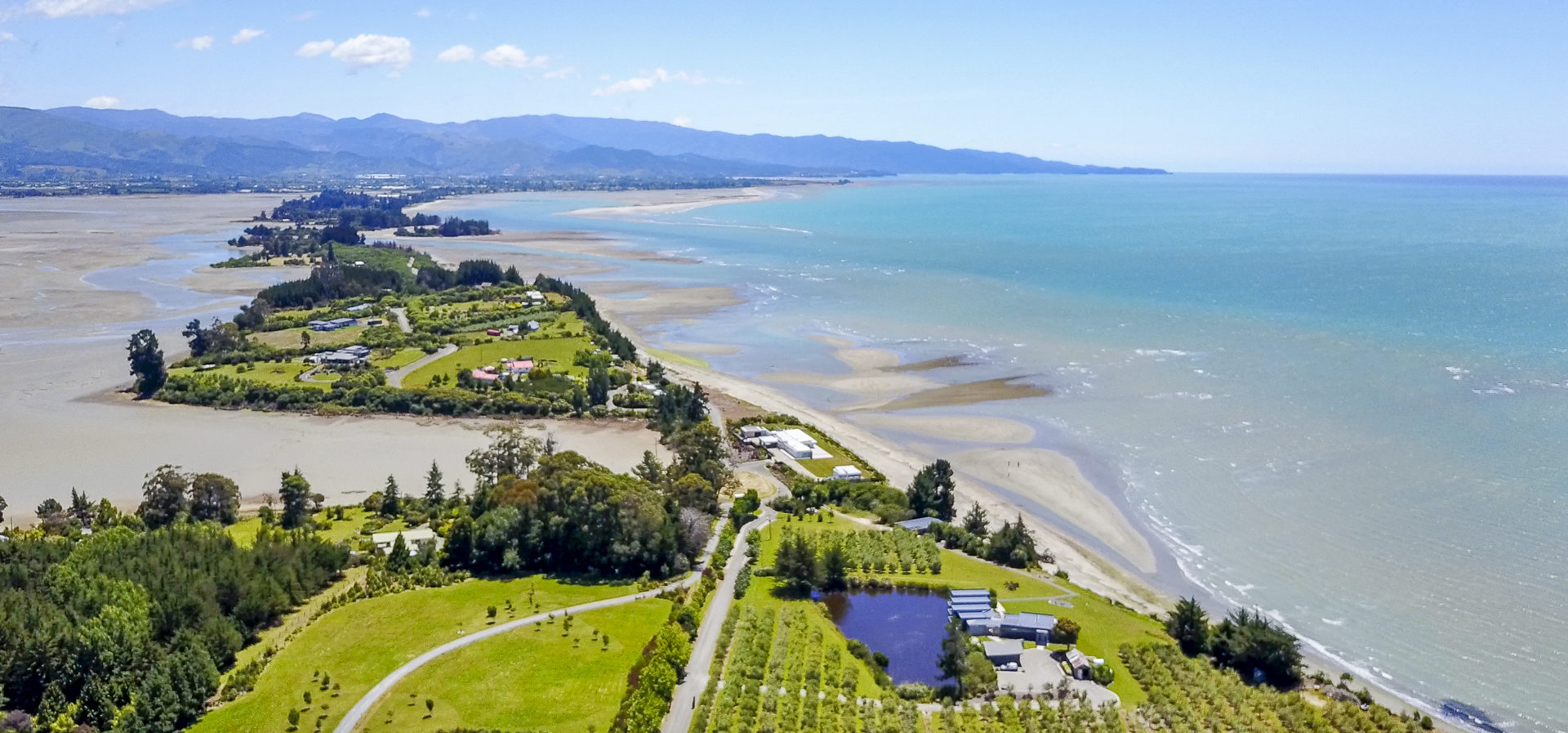 Able Tasman NP and the Tasman Mountains on the horizon.